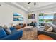 Bright living room offering serene water views, complete with elegant decor and comfortable seating arrangements at 13822 Carlow Park Dr, Riverview, FL 33579