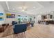 Open-concept living room with modern furnishings and a view of the water, seamlessly connecting to the kitchen at 13822 Carlow Park Dr, Riverview, FL 33579