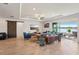 Stylish living room offering scenic water views, adorned with modern decor and comfortable seating areas at 13822 Carlow Park Dr, Riverview, FL 33579