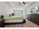 Comfortable main bedroom with a trey ceiling, tile floors, and plenty of storage at 13822 Carlow Park Dr, Riverview, FL 33579