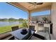 Outdoor dining on the screened patio with a stainless steel grill and lake views at 13822 Carlow Park Dr, Riverview, FL 33579