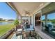 Relaxing screened-in patio with multiple seating areas and lake view at 13822 Carlow Park Dr, Riverview, FL 33579
