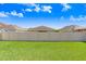 Spacious backyard featuring a well-maintained lawn, and a privacy fence at 15414 Fire Rock Pl, Ruskin, FL 33573