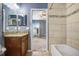 Bathroom featuring a granite-topped vanity, tile flooring, and a view into the bedroom at 15414 Fire Rock Pl, Ruskin, FL 33573