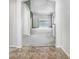 Spacious open-plan living area with tile entry and neutral gray walls and carpet at 15414 Fire Rock Pl, Ruskin, FL 33573