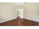 Bedroom with wood flooring, neutral paint, access to bathroom and closets at 15433 Lake Bella Vista Dr, Tampa, FL 33625