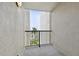 Private balcony offering picturesque views of the waterway and nearby palm trees at 1600 Gulf Blvd # 817, Clearwater Beach, FL 33767
