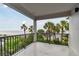 An outdoor balcony offers ocean views through palm trees at 1600 Gulf Blvd # 817, Clearwater Beach, FL 33767