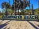 A sunny view of the Clearwater Beach sign on white sand at 1600 Gulf Blvd # 817, Clearwater Beach, FL 33767