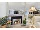 Stylish fireplace with marble surround and decorative accents in a well-lit living space at 1600 Gulf Blvd # 817, Clearwater Beach, FL 33767