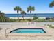 A community hot tub is near the beach with a beautiful view; spa rules are posted for residents at 1600 Gulf Blvd # 817, Clearwater Beach, FL 33767