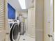 Efficient laundry room with modern washer, dryer, and water heater at 1600 Gulf Blvd # 817, Clearwater Beach, FL 33767