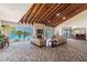 A stylish common area with ocean views, cozy seating, a fireplace, and a wood-beamed ceiling at 1600 Gulf Blvd # 817, Clearwater Beach, FL 33767