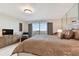 Bright primary bedroom with large window and neutral colored wall and window dressings at 1600 Gulf Blvd # 817, Clearwater Beach, FL 33767