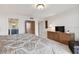 Bedroom with neutral patterned bedding, tile floors, and access to a bathroom at 1600 Gulf Blvd # 817, Clearwater Beach, FL 33767