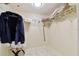 Organized walk-in closet with multiple shelves and hanging space for efficient storage solutions at 1600 Gulf Blvd # 817, Clearwater Beach, FL 33767