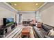 Finished basement with comfortable seating, modern TV, and area rug at 16211 Villarreal De Avila, Tampa, FL 33613