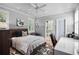 Bedroom with neutral tones, wooden bed frame, and dedicated desk workspace at 16211 Villarreal De Avila, Tampa, FL 33613