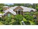Stunning brick home featuring lush landscaping, manicured bushes, and a tiled roof at 16211 Villarreal De Avila, Tampa, FL 33613