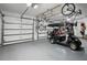 A spacious garage featuring bike racks and a golf cart at 16211 Villarreal De Avila, Tampa, FL 33613