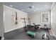 Home gym featuring rubber flooring, modern lighting, and various weightlifting equipment at 16211 Villarreal De Avila, Tampa, FL 33613