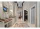 Hallway view showcasing vanity, tile flooring, and access to the closet at 16211 Villarreal De Avila, Tampa, FL 33613