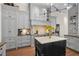 Well-equipped kitchen featuring granite countertops, Wolf range, island, ample storage and hardwood floors at 16211 Villarreal De Avila, Tampa, FL 33613