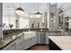 Well-appointed kitchen features granite countertops, stainless steel appliances, and a farmhouse sink at 16211 Villarreal De Avila, Tampa, FL 33613