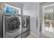 Laundry room with stainless steel washer and dryer at 16211 Villarreal De Avila, Tampa, FL 33613