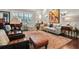 Comfortable living room with large windows, piano, and a plush rug at 16211 Villarreal De Avila, Tampa, FL 33613