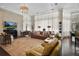 Bright living room enhanced by large windows, hardwood floors, fireplace, and open layout at 16211 Villarreal De Avila, Tampa, FL 33613