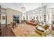 Bright living room enhanced by large windows, hardwood floors, fireplace, and open layout at 16211 Villarreal De Avila, Tampa, FL 33613