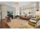 Bright living room enhanced by large windows, hardwood floors, fireplace, and open layout at 16211 Villarreal De Avila, Tampa, FL 33613