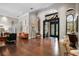 Spacious living room featuring wood floors, large arches, and backyard views at 16211 Villarreal De Avila, Tampa, FL 33613