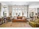 Bright living room enhanced by large windows, hardwood floors, open layout and comfortable seating at 16211 Villarreal De Avila, Tampa, FL 33613