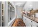 Practical mudroom with storage, washer/dryer, sink, granite countertop and convenient access to laundry at 16211 Villarreal De Avila, Tampa, FL 33613