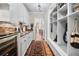 Functional mudroom providing storage, sink, granite countertop, and a seamless transition to adjacent areas at 16211 Villarreal De Avila, Tampa, FL 33613