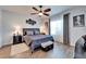 Bedroom featuring a king bed, dark furniture, modern decor, dark wood floors, and neutral color palette at 1806 Lake George Cv, Bradenton, FL 34211