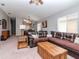 Spacious living room with plush, wrap around leather seating and modern furnishings at 18217 Portside St, Tampa, FL 33647