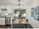 This dining room boasts wood floors, stainless steel appliances, and sliding doors to allow for natural light at 1828 Barbara Ln, Clearwater, FL 33755