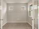 Well-lit bedroom with hardwood floors and double doors, offering plenty of natural light at 20411 Symphony Pl, Venice, FL 34293