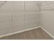 Close-up shot of a carpeted walk-in closet equipped with wire shelving for organization at 20411 Symphony Pl, Venice, FL 34293
