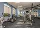 Bright gym featuring cardio equipment and large windows at 20411 Symphony Pl, Venice, FL 34293