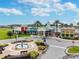 Aerial view of a community center featuring unique architecture and a fountain at 21577 Violet Periwinkle Dr, Land O Lakes, FL 34637