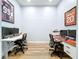 Spacious home office featuring dual workstations and wood flooring at 2204 Margaret Way, Dunedin, FL 34698