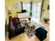 Overhead view of well-lit living room with modern furnishings and patio access at 2205 Belleair Rd # A7, Clearwater, FL 33764