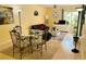 Open-concept living and dining area with light flooring and bright yellow walls at 2205 Belleair Rd # A7, Clearwater, FL 33764