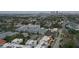 An aerial view shows townhomes near a city skyline in a vibrant neighborhood at 224 S Audubon Ave, Tampa, FL 33609