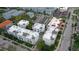 An aerial view of modern townhomes showcases their rooftop designs and community layout at 224 S Audubon Ave, Tampa, FL 33609