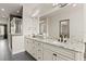 Elegant bathroom featuring double sinks, granite countertops, and a glass-enclosed shower at 224 S Audubon Ave, Tampa, FL 33609